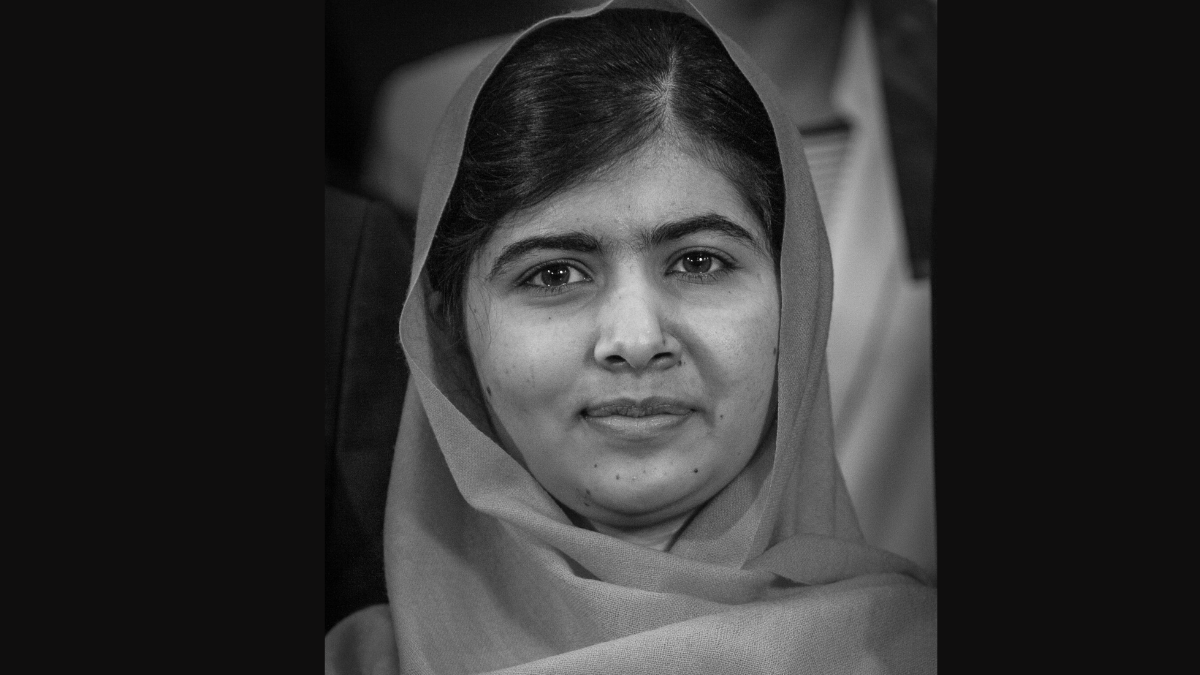 "An empowering portrait of Malala Yousafzai, her eyes reflecting determination and strength, serving as a beacon of resilience that inspires millions around the globe."