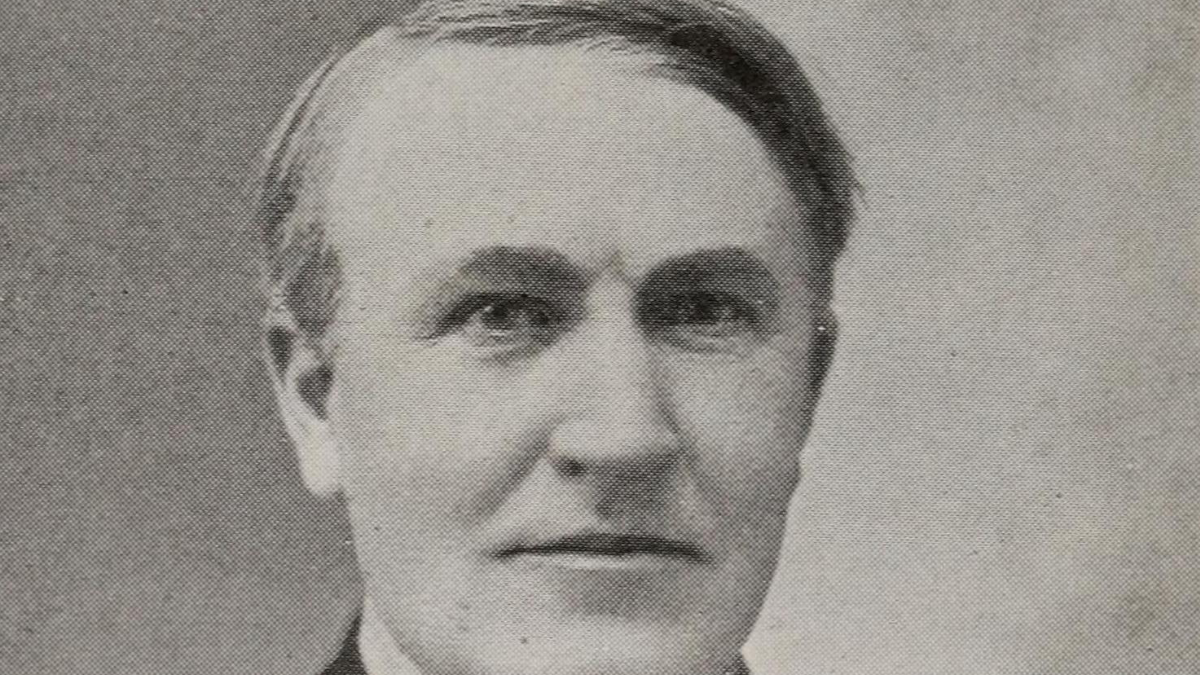 "An inspiring image of Thomas Edison, his face illuminated by the glow of his invention - the light bulb, symbolizing resilience and perseverance in overcoming failures to achieve success."