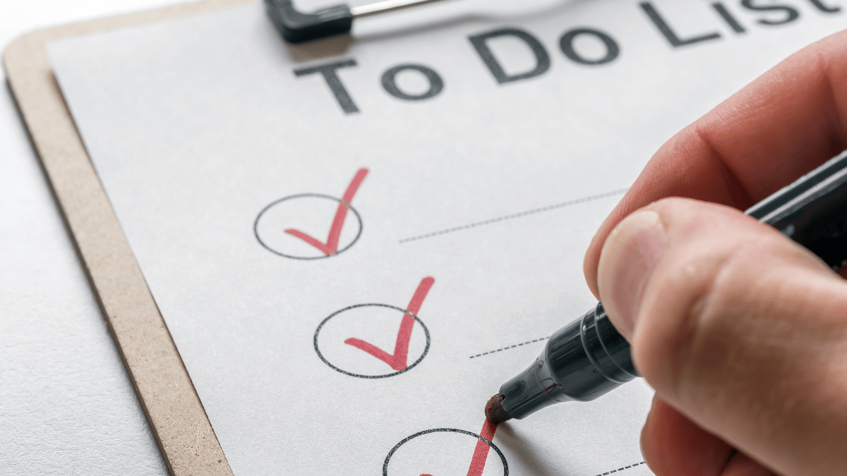 Image of a Hand Writing a To-do List: A close-up shot of a hand meticulously jotting down tasks on a notepad. Each line represents a commitment, a promise to yourself. This image is a reflection of your daily battles with procrastination. It serves as a reminder that planning and organization are key strategies to maintain focus and increase productivity.