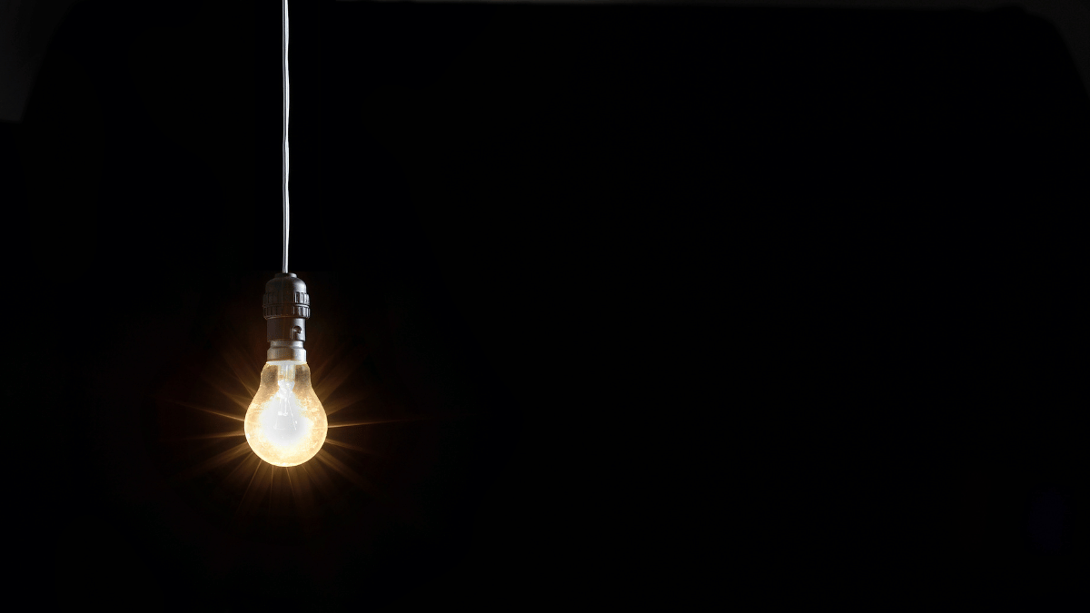 Image of a Lightbulb Illuminated Against a Dark Background: A single light bulb glows brightly against a dark background, casting a warm, inviting light. This is a beacon of hope and inspiration, symbolizing the brilliant ideas that lie within you, waiting to be brought to life. Don't let procrastination dim this light. Ignite it with your focus and productivity.