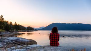 Image of a Woman Overlooking a Sunrise: A woman stands alone on a hilltop, her silhouette outlined against the backdrop of a sky ablaze with the colors of dawn. Her gaze is fixed on the horizon, where the first rays of sunlight are breaking through the darkness. This image is a testament to your journey of overcoming procrastination. It reminds you that every new day brings a fresh start, an opportunity to focus on your tasks and increase your productivity. You are not alone in this journey; we're here to support and guide you.